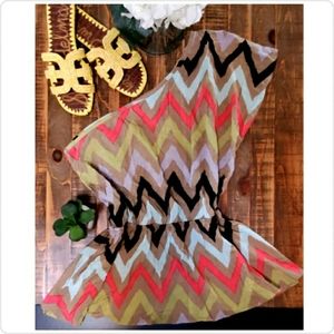 Super cute BCBG asymmetrical peplum top🌺